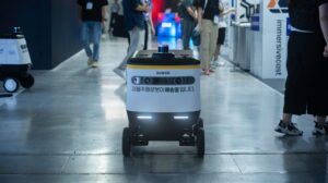 Autonomous delivery robot navigating indoors, representing an autonomous mobile robot Singapore factories can deploy