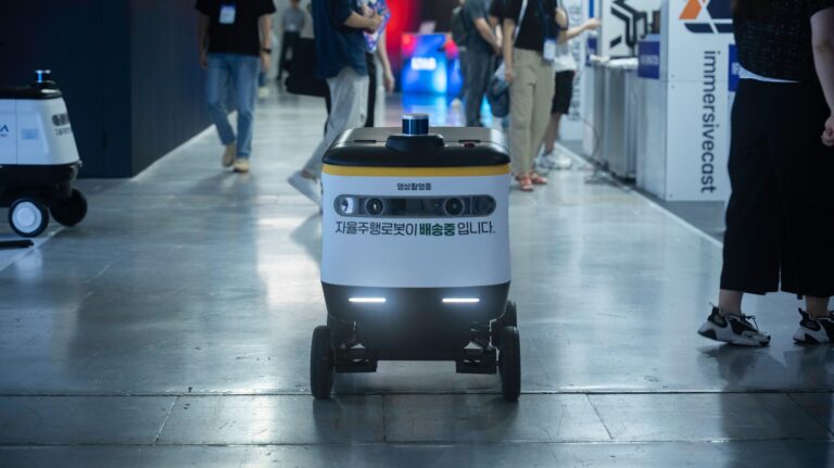 Autonomous delivery robot navigating indoors, representing an autonomous mobile robot Singapore factories can deploy