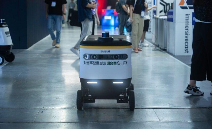 Autonomous delivery robot navigating indoors, representing an autonomous mobile robot Singapore factories can deploy